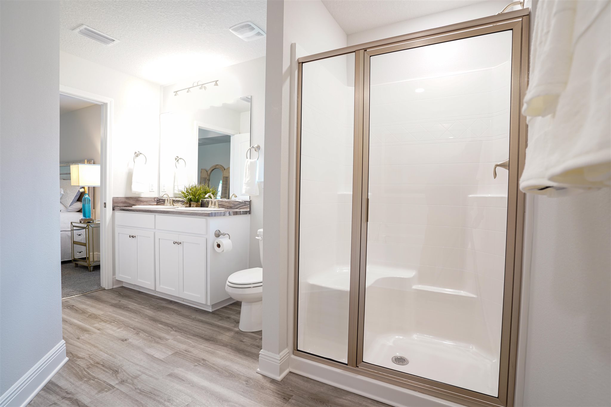 1813 Leigh Loop Cantonment, FL 32533 - Photo 7 of 15 a bathroom with a granite countertop sink toilet and shower