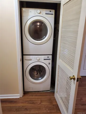 a view of a hallway with washer and dryer