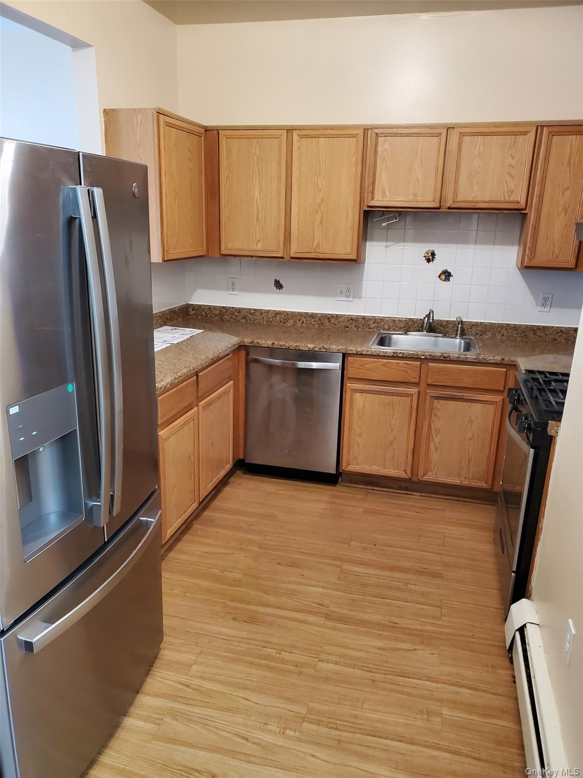 75 Pipetown Hill Road Nanuet, NY 10954 - Photo 5 of 14 a kitchen with granite countertop a refrigerator stove and sink