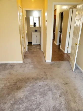 a view of a bathroom with a sink and a mirror