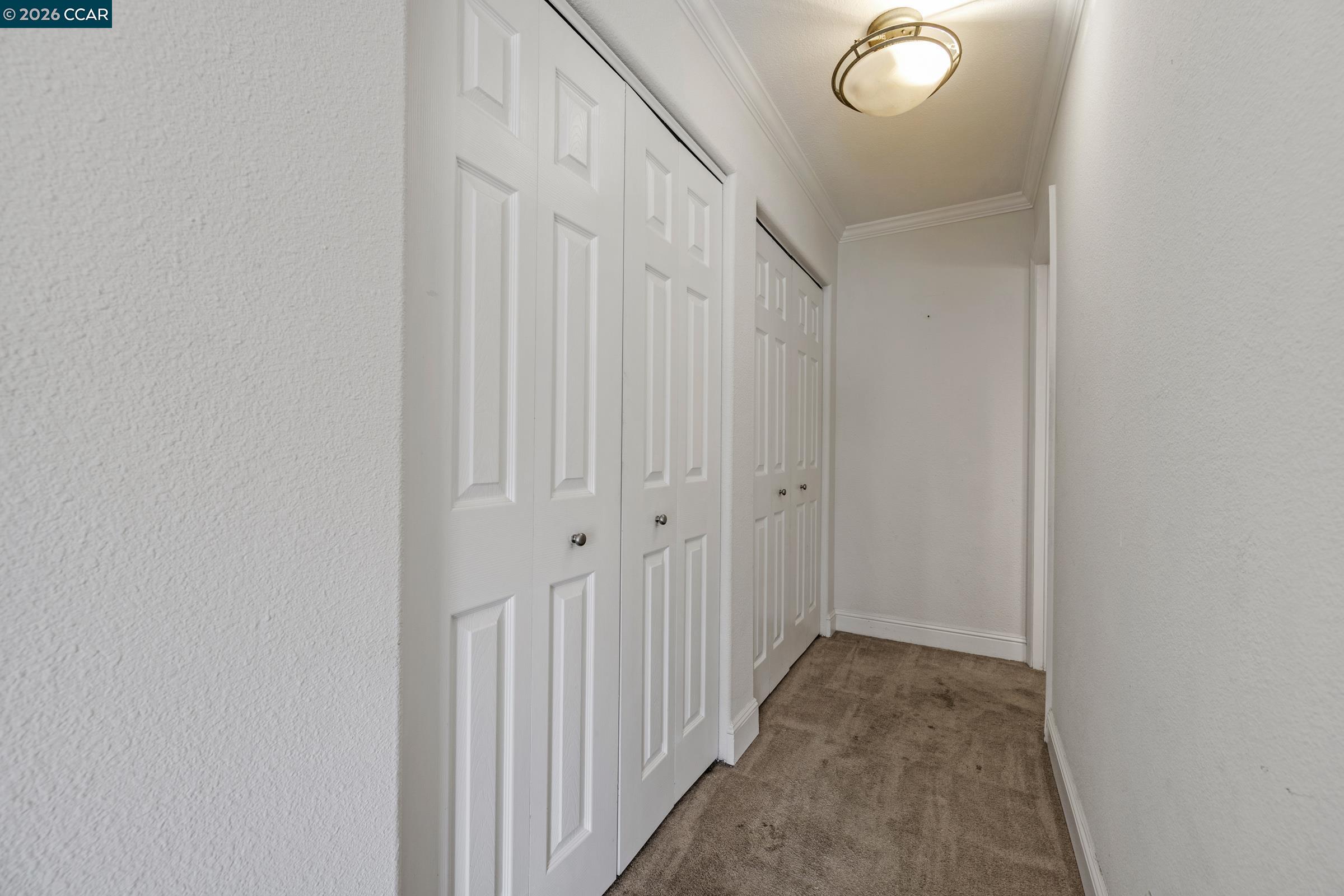 1544 Bailey Road, Unit 30 Concord, CA 94521 - Photo 24 of 33 a view of a hallway with wooden floor