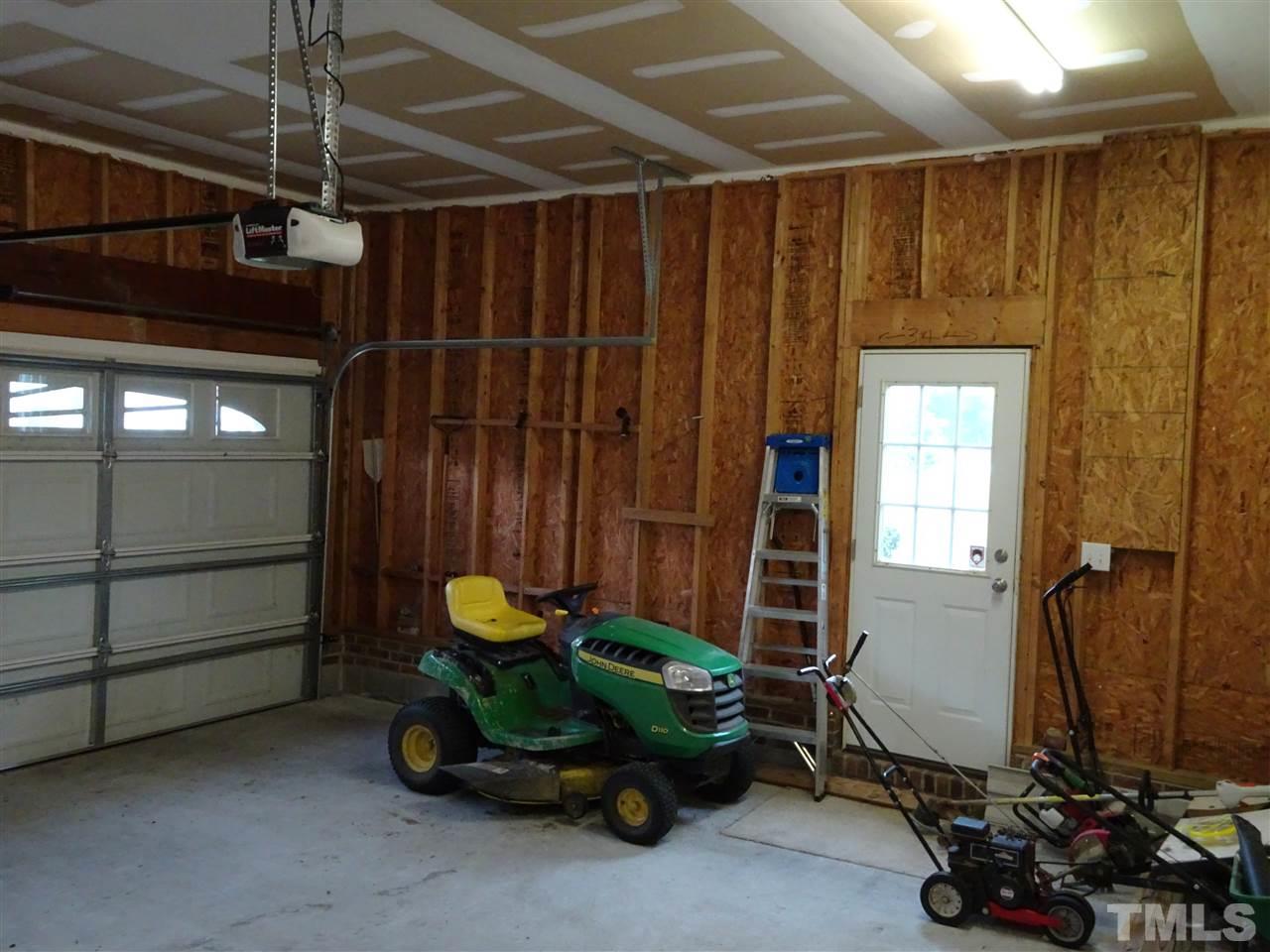 104 West Waycliff Road Henderson, NC 27537 - Photo 23 of 25 There is a passage door to the back yard from the garage