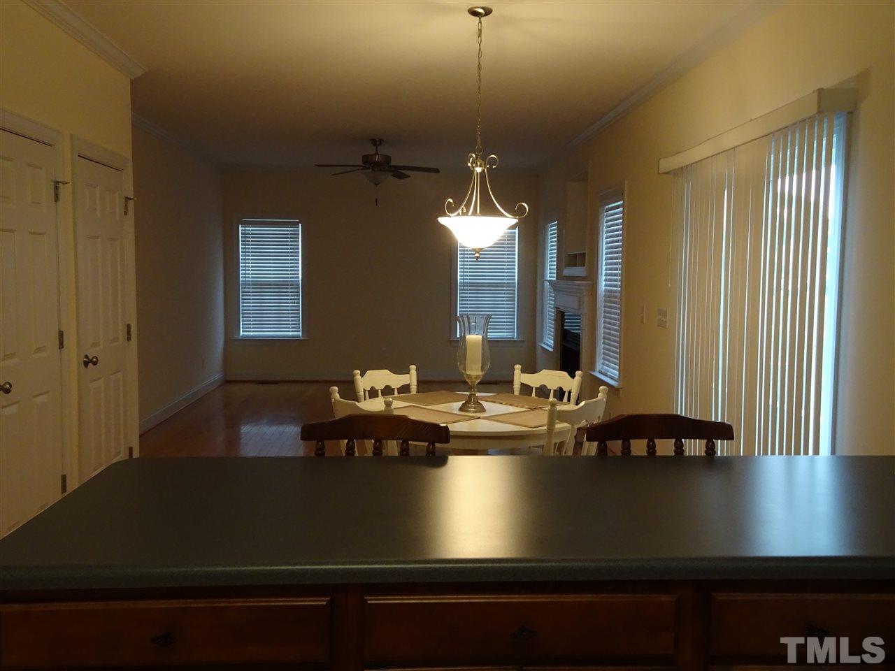 104 West Waycliff Road Henderson, NC 27537 - Photo 9 of 25 Off the kitchen is the breakfast area in front of the sliding glass door to the rear deck
