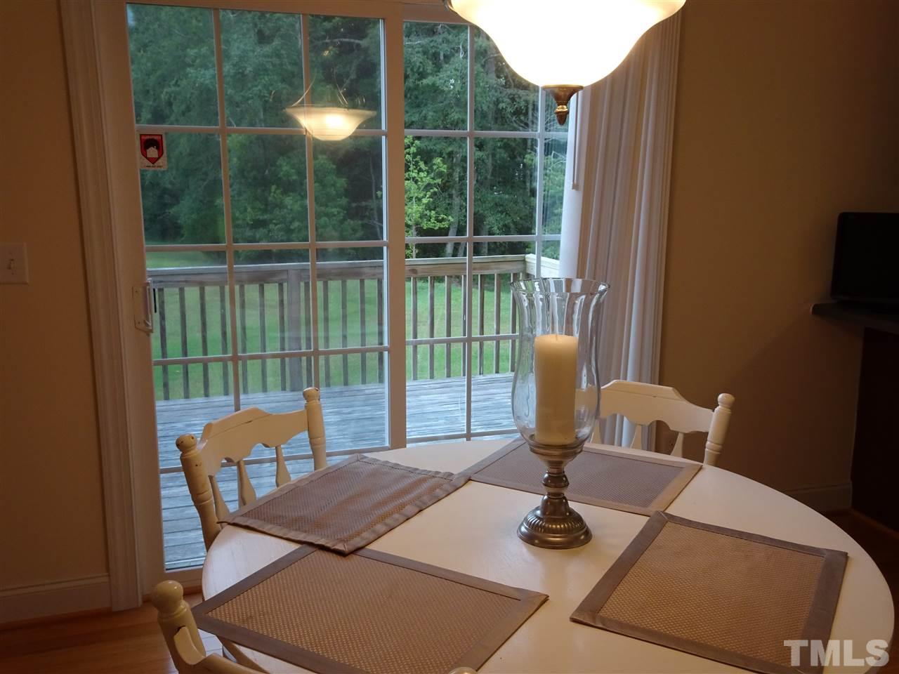 104 West Waycliff Road Henderson, NC 27537 - Photo 10 of 25 From the breakfast area is the sliding glass door to the back deck