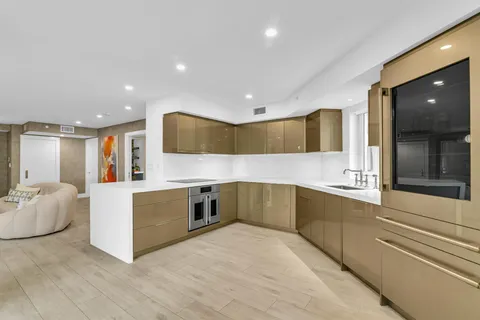 a utility room with sink dryer and washer
