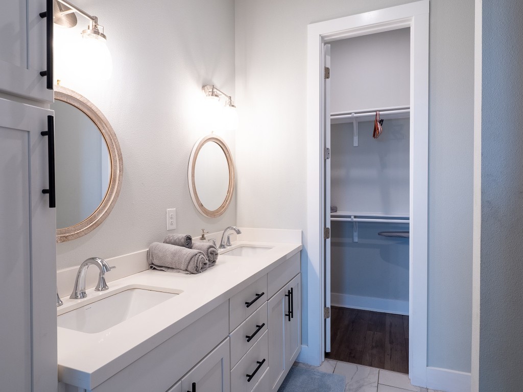 4507 East Martin Luther King Jr Boulevard, Unit 123 Austin, TX 78721 - Photo 13 of 26 Full bathroom with a walk in closet and double vanity