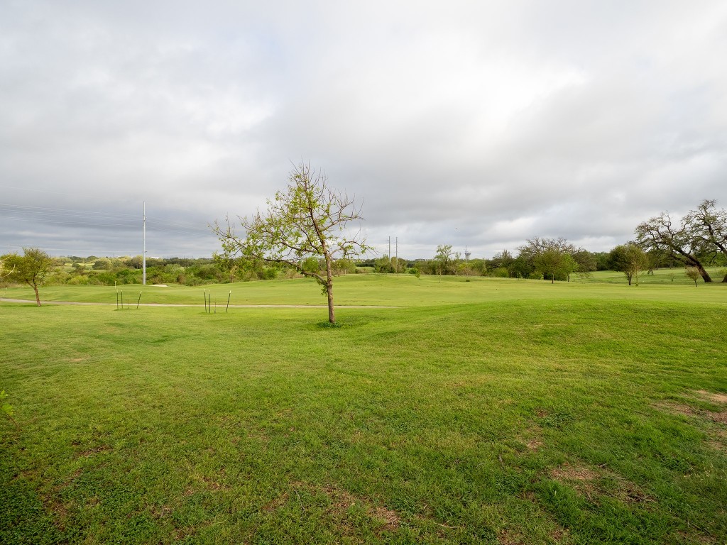 4507 East Martin Luther King Jr Boulevard, Unit 123 Austin, TX 78721 - Photo 21 of 26 View of green lawn featuring view of golf course