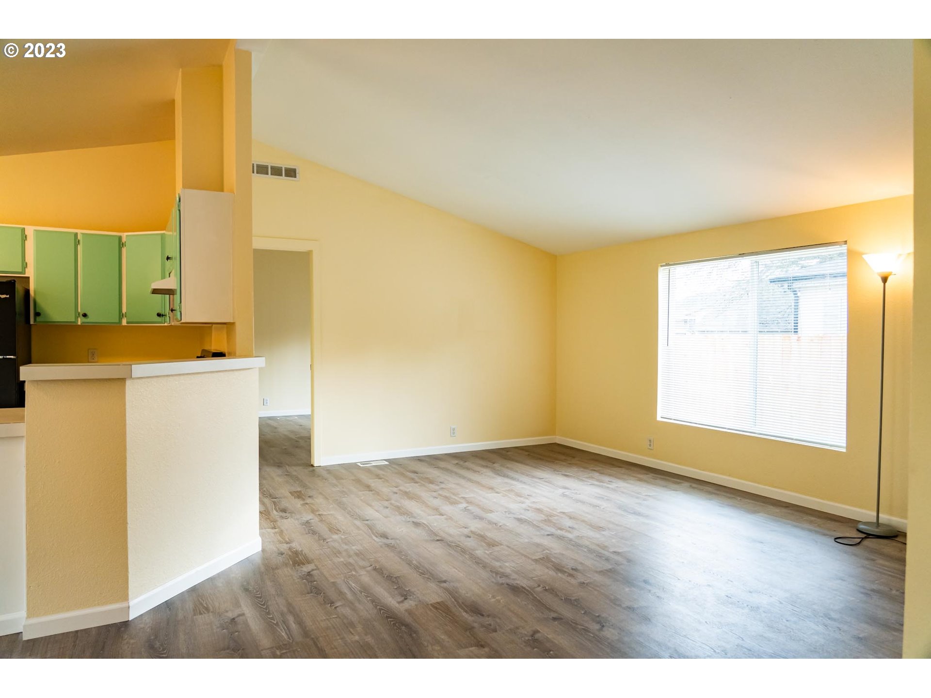 938 Water Street Springfield, OR 97477 - Photo 12 of 28 a view of a kitchen with a fridge
