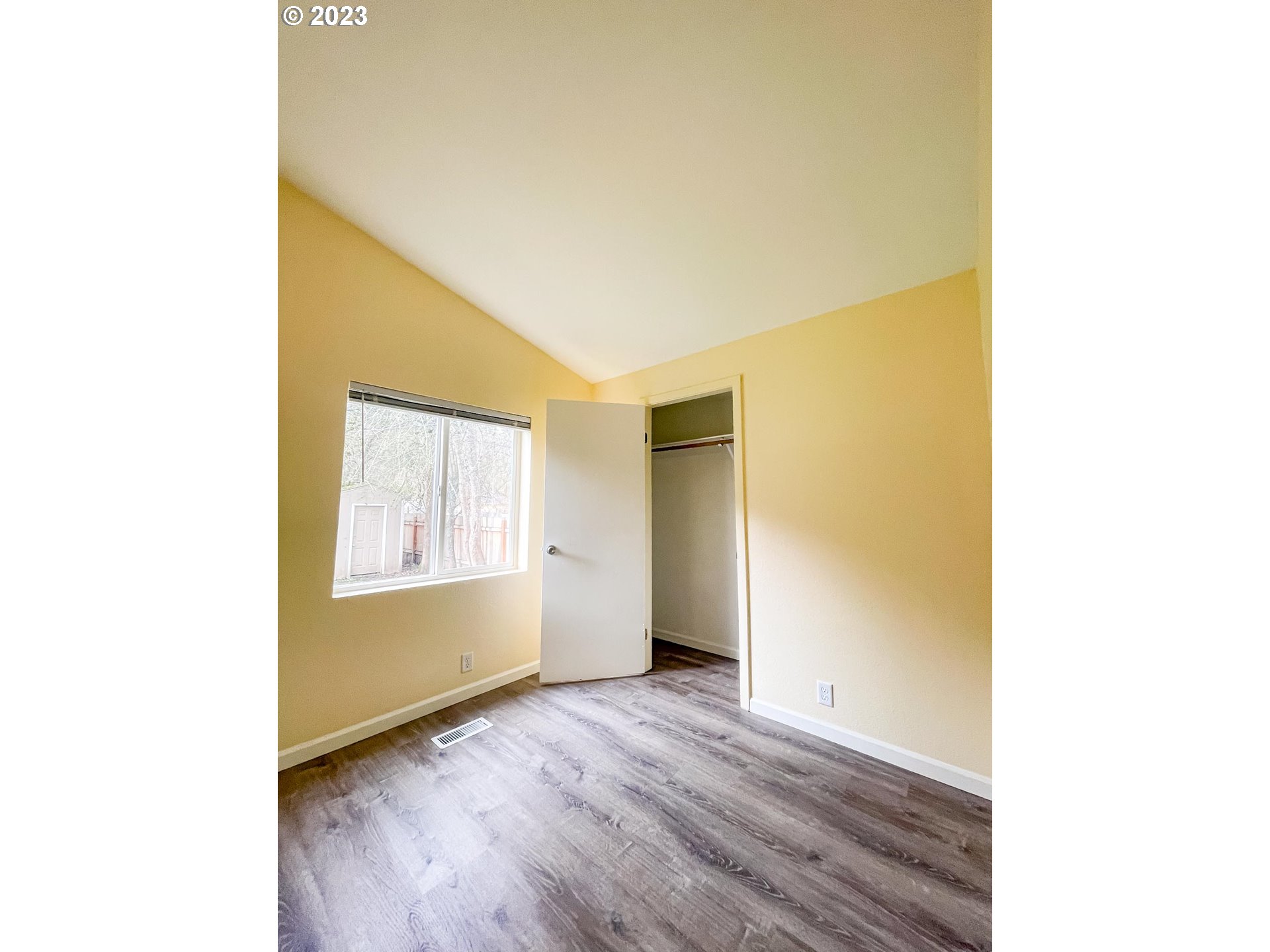 938 Water Street Springfield, OR 97477 - Photo 18 of 28 a view of an empty room with wooden floor