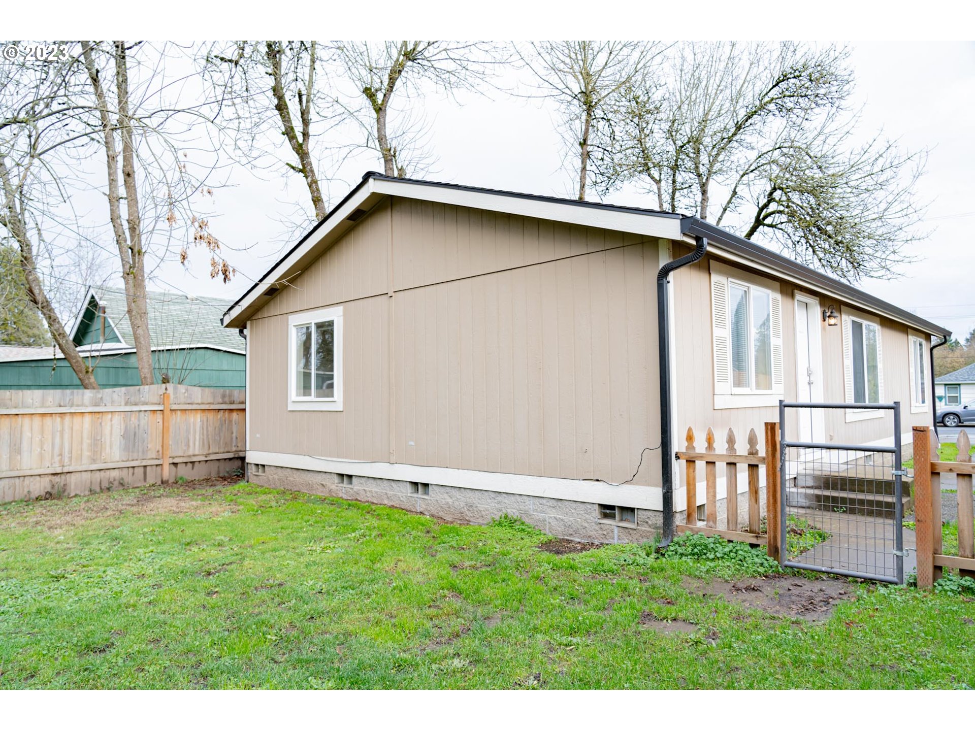 938 Water Street Springfield, OR 97477 - Photo 23 of 28 a view of backyard with a garden and deck