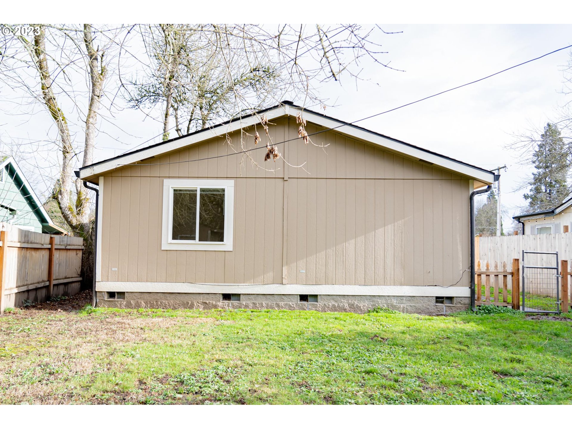 938 Water Street Springfield, OR 97477 - Photo 25 of 28 a backyard of a house with lots of green space