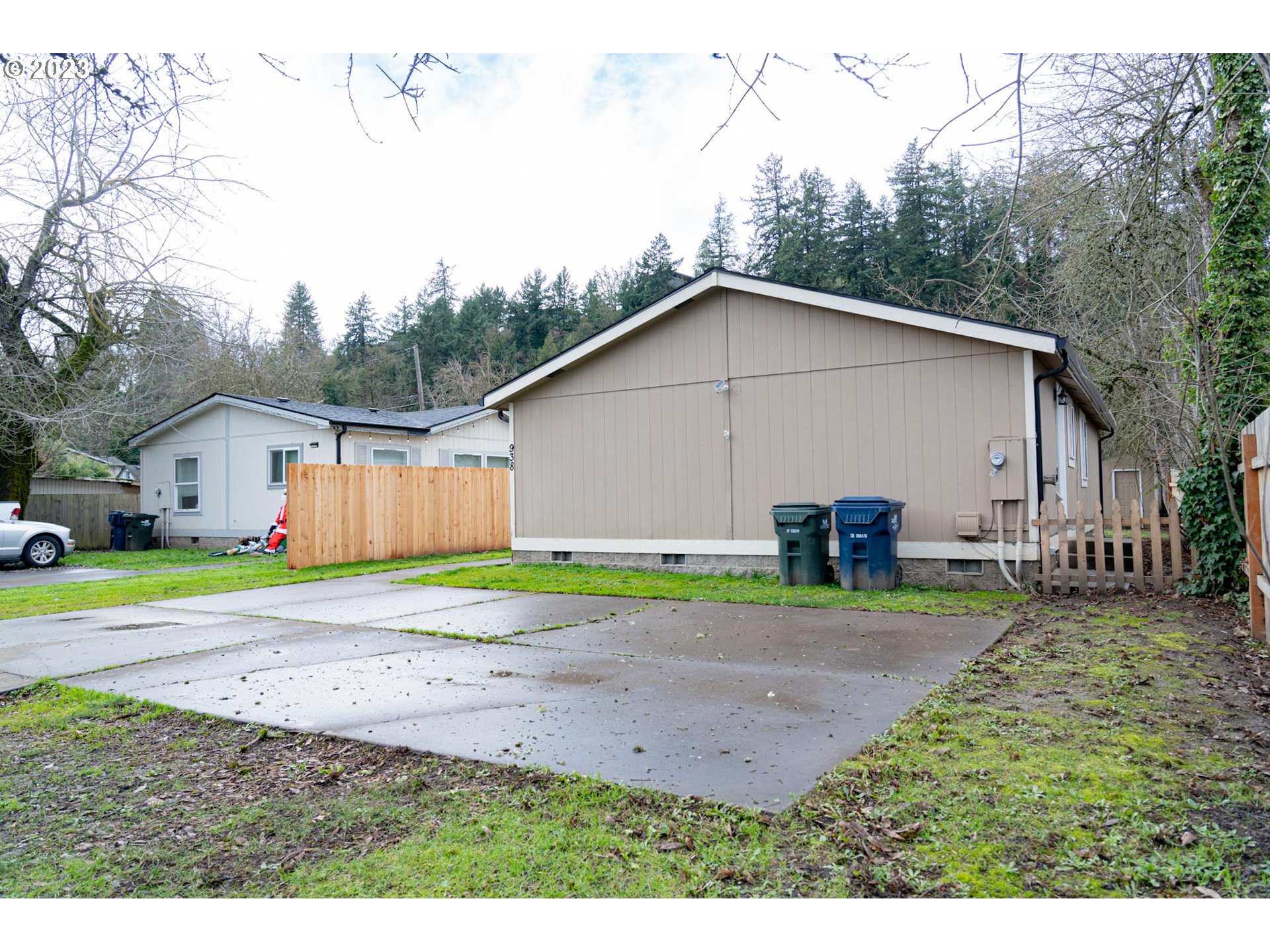 938 Water Street Springfield, OR 97477 - Photo 3 of 28 a view of a house with backyard and trees
