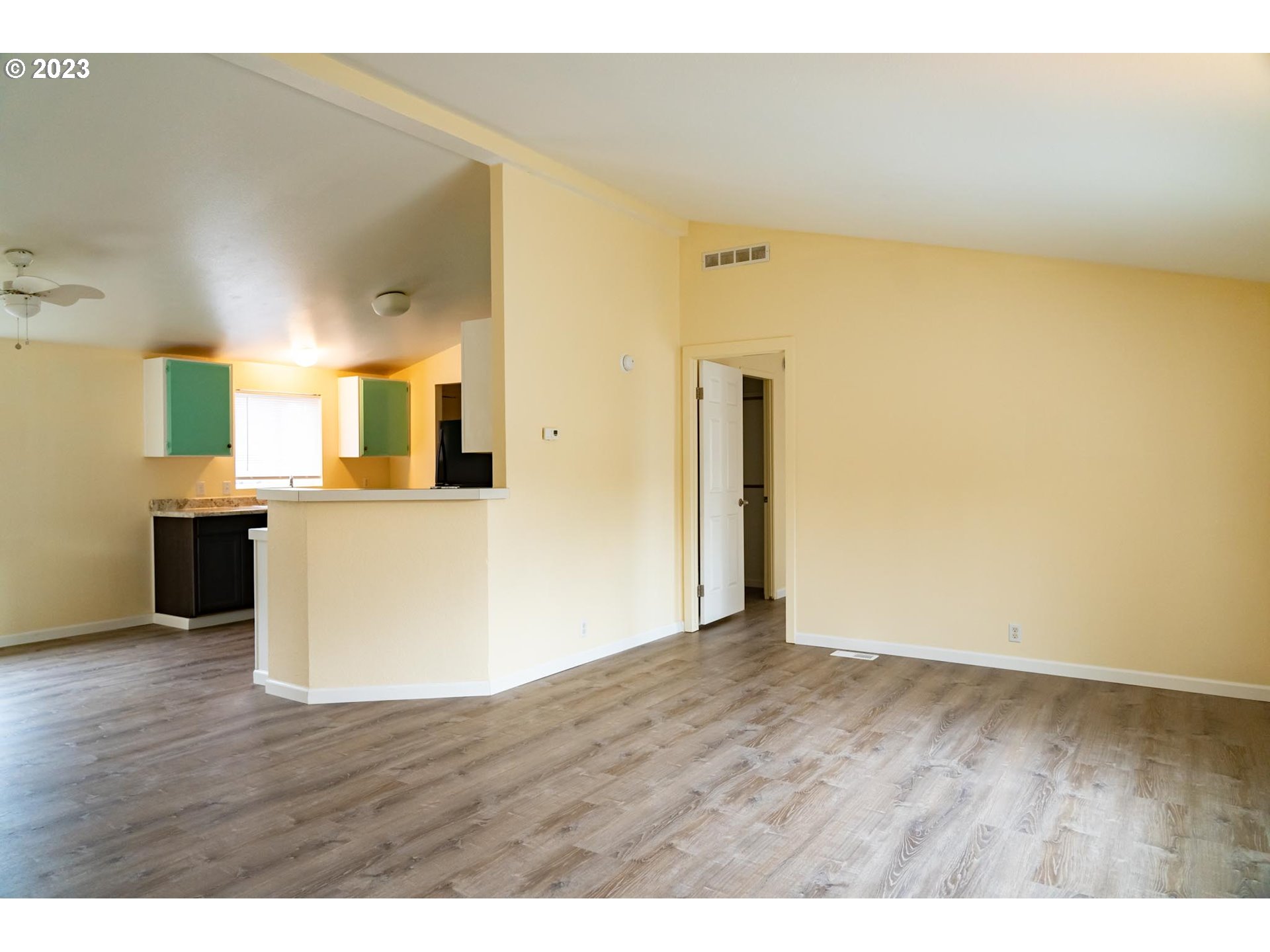 938 Water Street Springfield, OR 97477 - Photo 4 of 28 a view of a kitchen with wooden floor