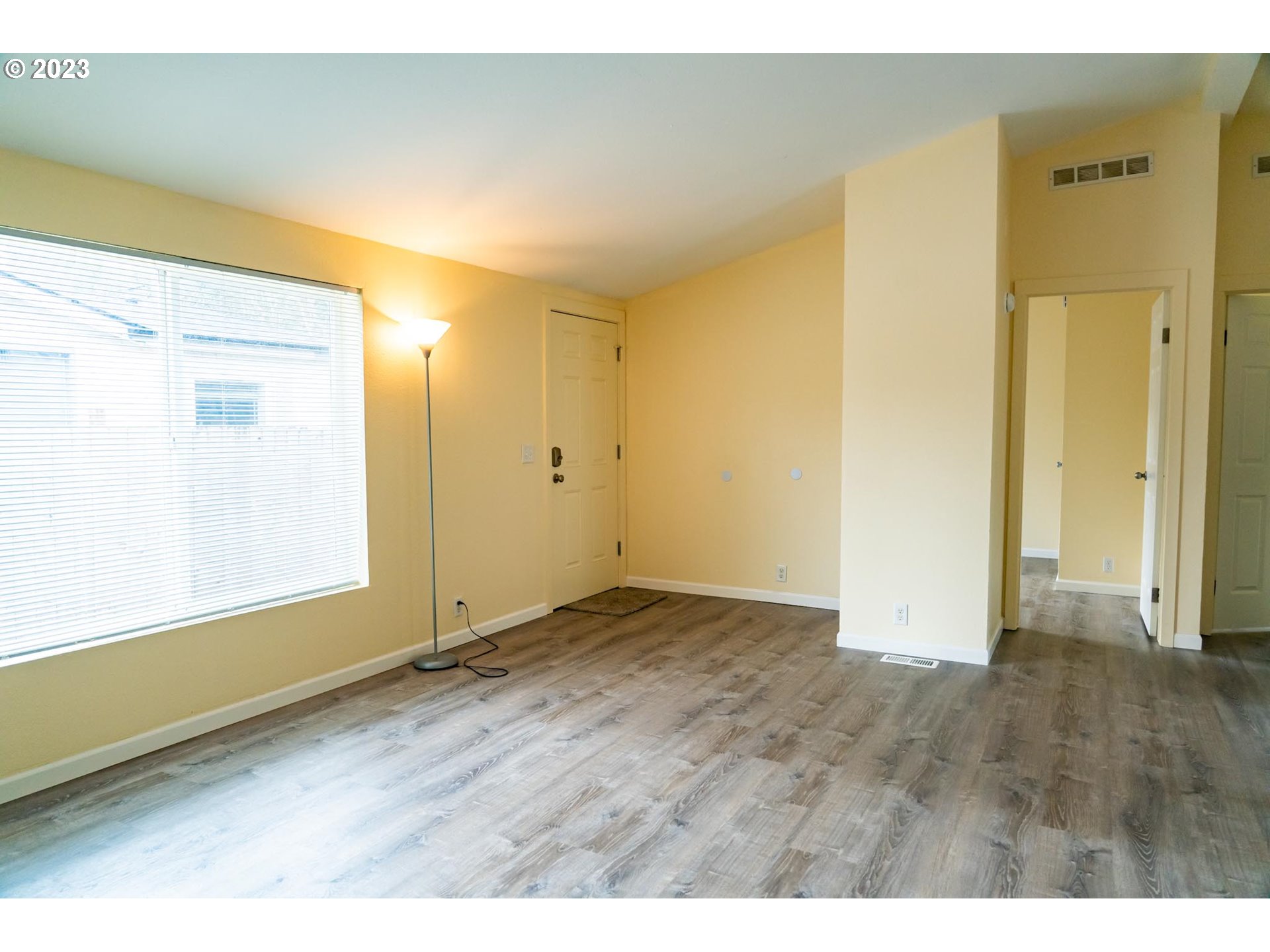 938 Water Street Springfield, OR 97477 - Photo 5 of 28 a view of an empty room with wooden floor