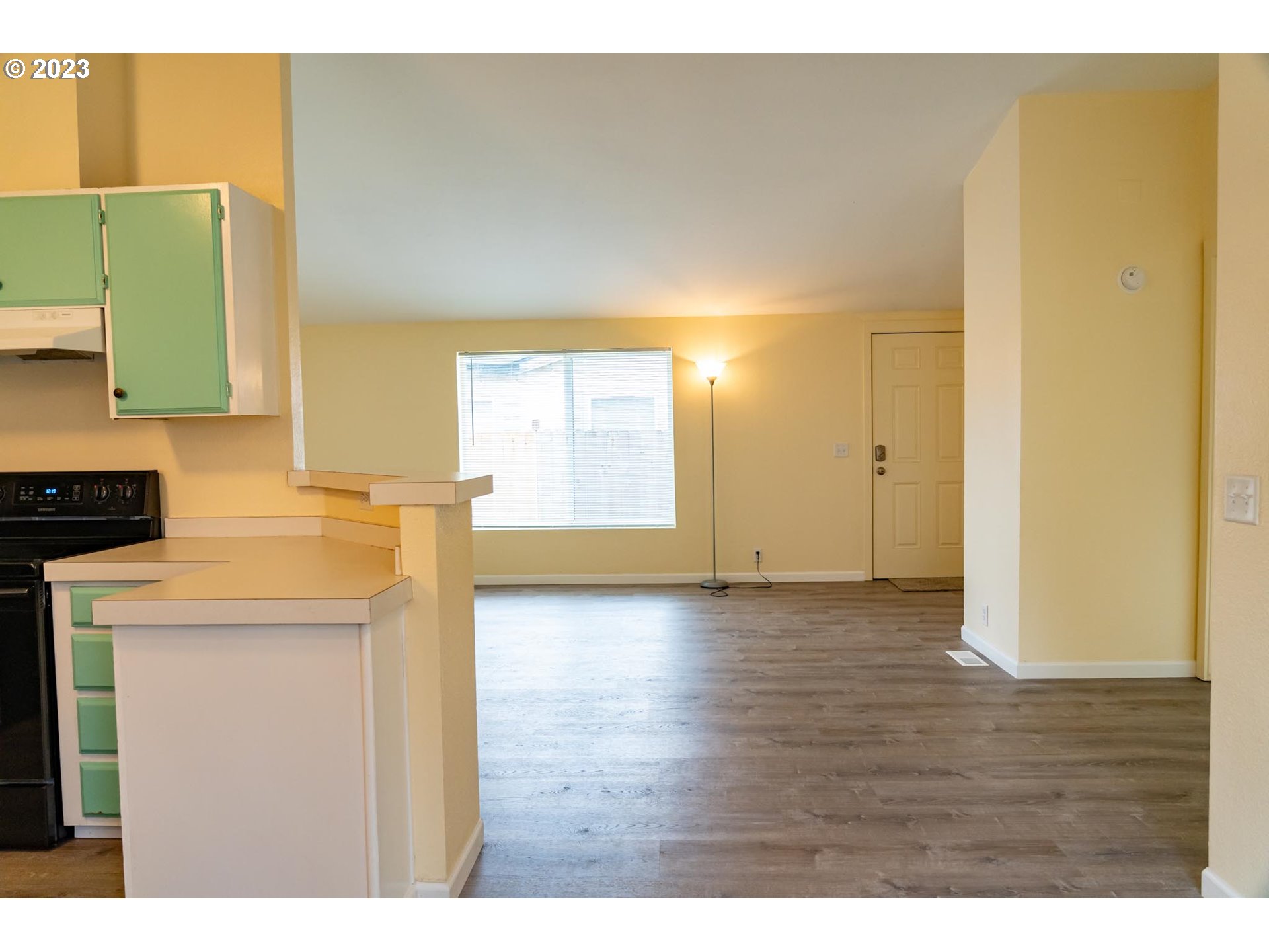 938 Water Street Springfield, OR 97477 - Photo 10 of 28 a view of a kitchen with wooden floor and a sink