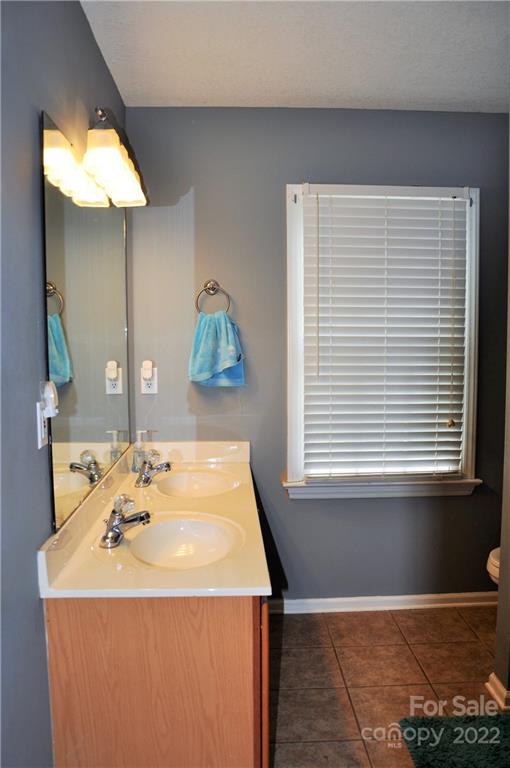 145 Major Fergusons Hill Rutherfordton, NC 28139 - Photo 29 of 31 a bathroom with a sink and a mirror