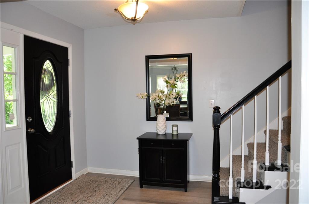 145 Major Fergusons Hill Rutherfordton, NC 28139 - Photo 6 of 31 a view of a hallway with wooden floor and staircase