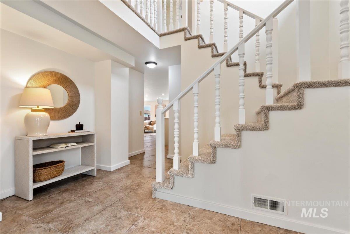 4297 Nystrom Way Boise, ID 83713 - Photo 12 of 50 Staircase near entry featuring vaulted ceiling
