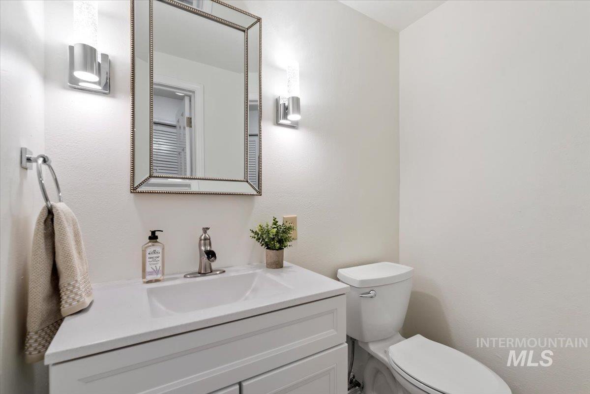 4297 Nystrom Way Boise, ID 83713 - Photo 15 of 50 Half bathroom with toilet and vanity on main floor