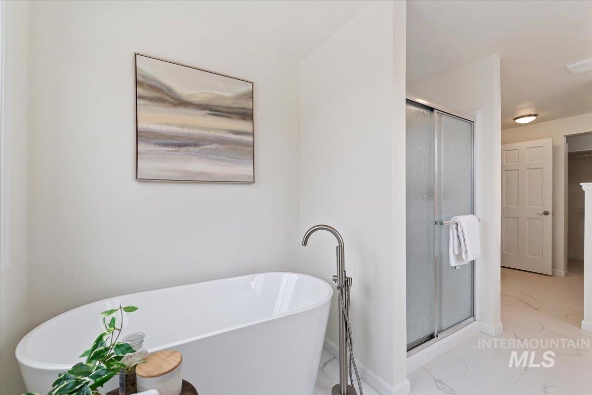 4297 Nystrom Way Boise, ID 83713 - Photo 19 of 50 Full brand new bathroom with a stall shower and a freestanding bath with plenty of natural light