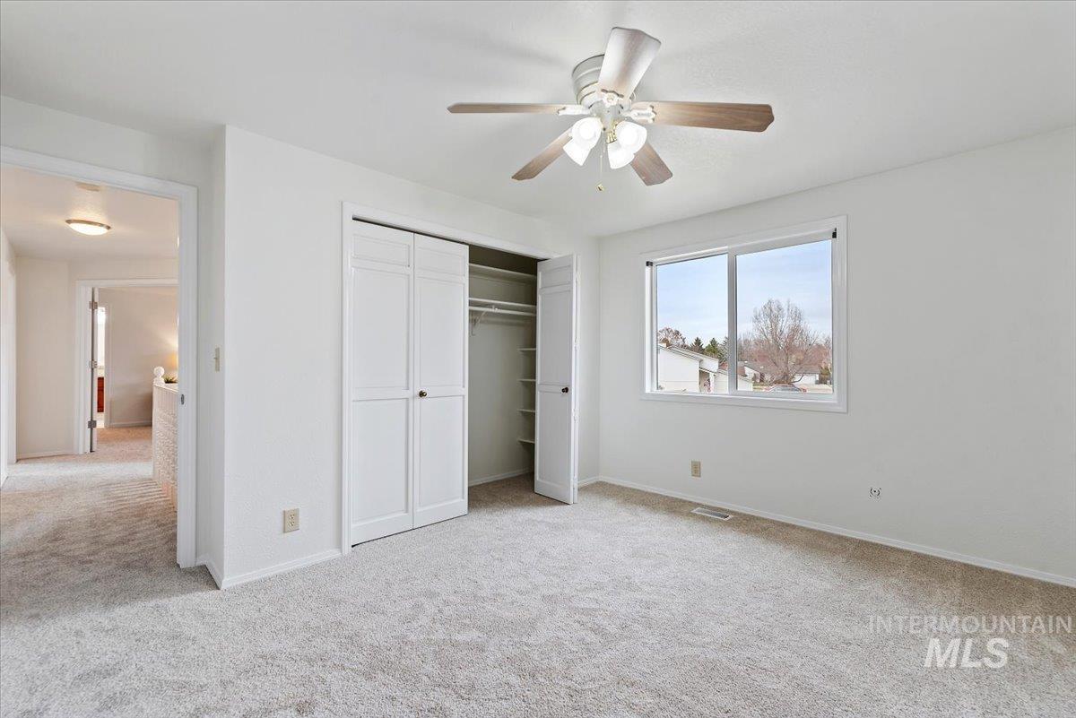 4297 Nystrom Way Boise, ID 83713 - Photo 21 of 50 Unfurnished bedroom featuring light carpet, a closet, and ceiling fan