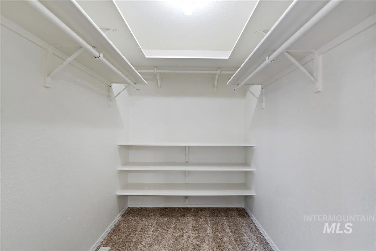 4297 Nystrom Way Boise, ID 83713 - Photo 23 of 50 Upstairs bedroom walk in closet featuring light carpet
