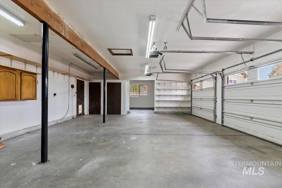 4297 Nystrom Way Boise, ID 83713 - Photo 34 of 50 View of 3 car portion of garage with 2 storage closets and built-in shelves