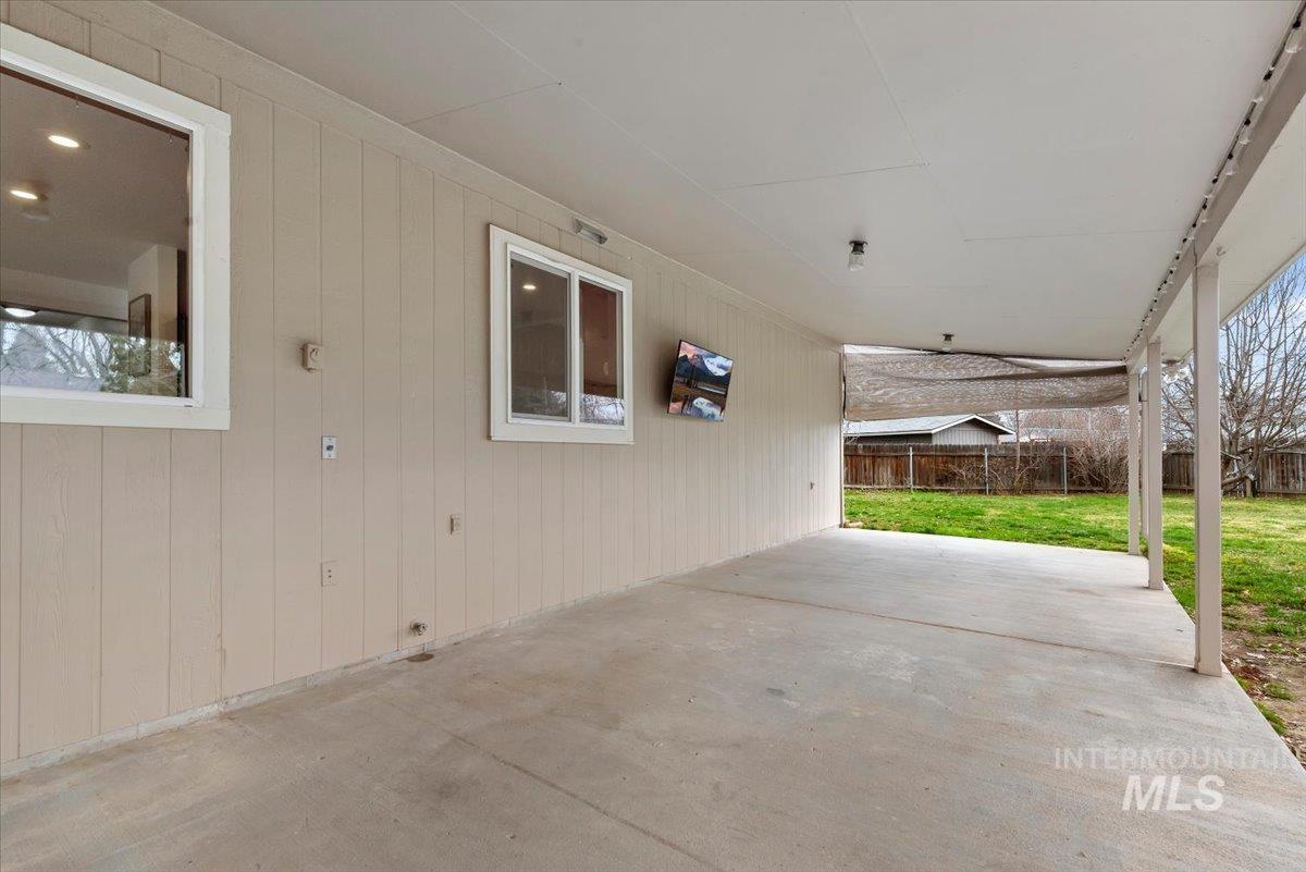 4297 Nystrom Way Boise, ID 83713 - Photo 37 of 50 View of patio with mounted TV and privacy shade
