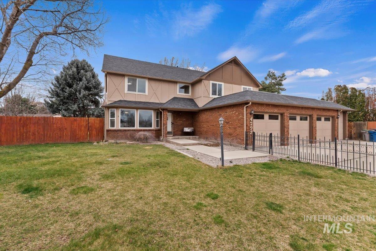 4297 Nystrom Way Boise, ID 83713 - Photo 45 of 50 View of front of home featuring a patio area, a garage, brick siding, board and batten siding, and concrete driveway