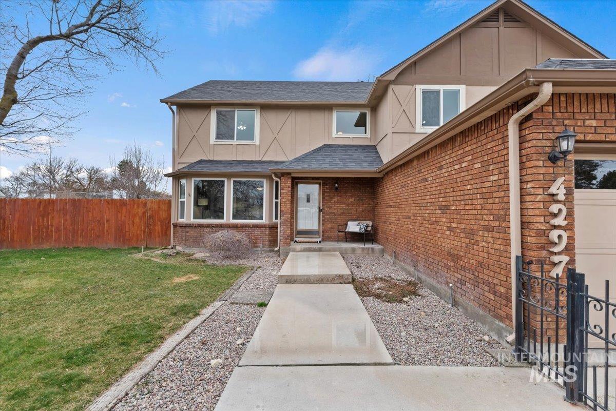 4297 Nystrom Way Boise, ID 83713 - Photo 46 of 50 View of front facade with brick siding, roof with shingles, and board and batten siding