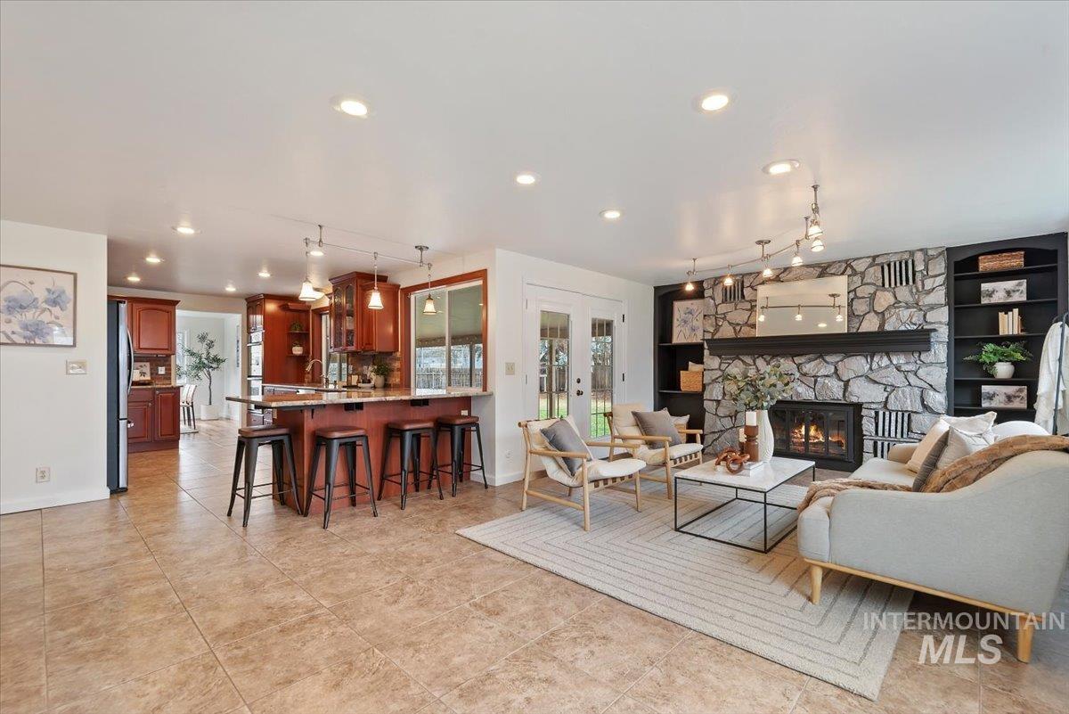 4297 Nystrom Way Boise, ID 83713 - Photo 8 of 50 Family Room off Kitchen with a wood burning fireplace