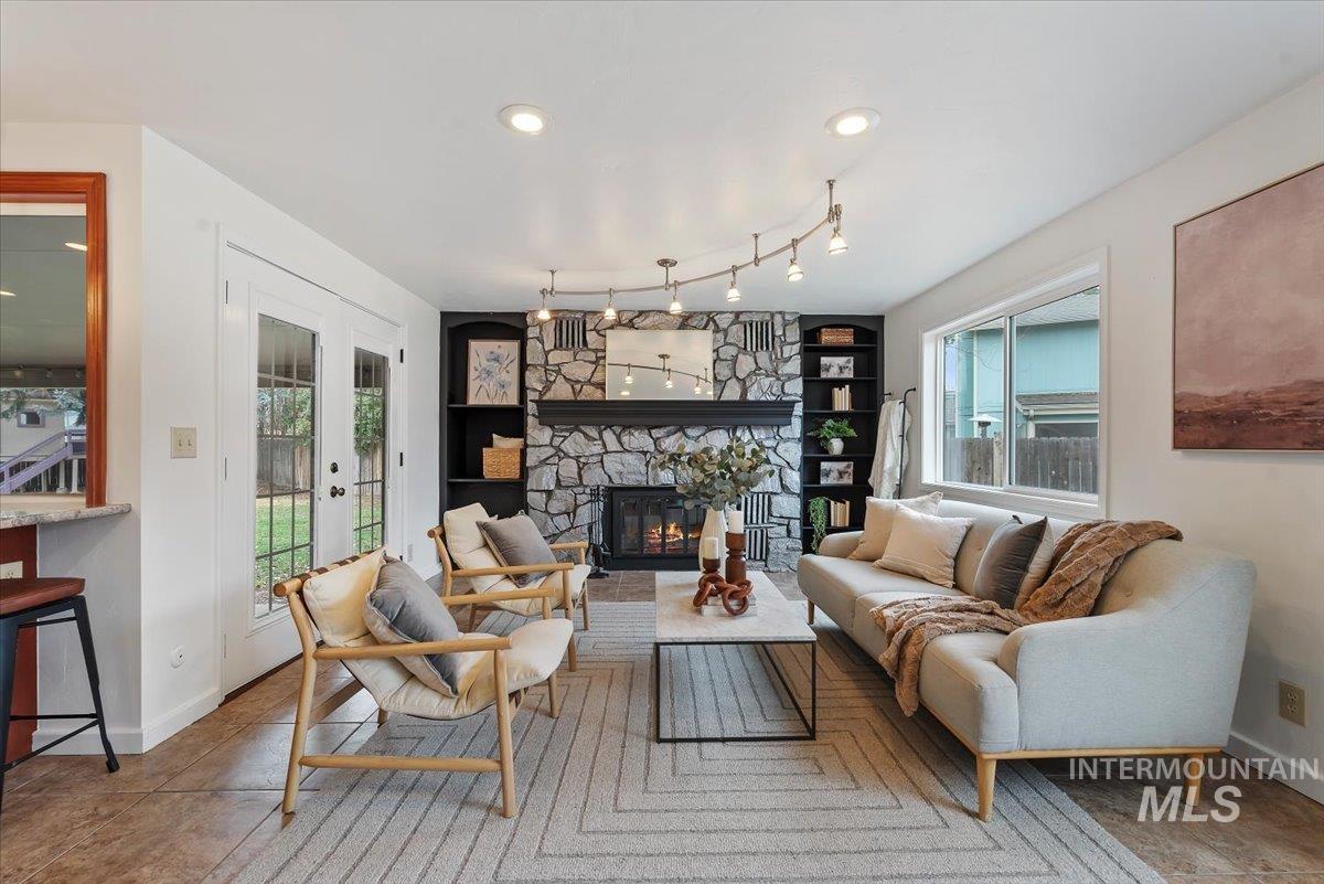 4297 Nystrom Way Boise, ID 83713 - Photo 10 of 50 Living area featuring recessed lighting, natural light, and a wood burning fireplace