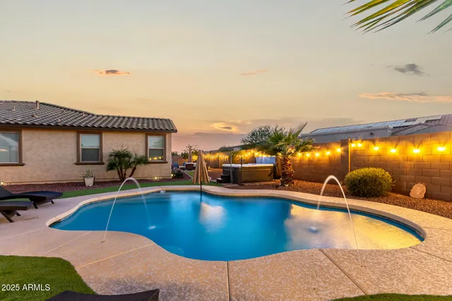 a view of a patio with a dining table and chairs with wooden floor
