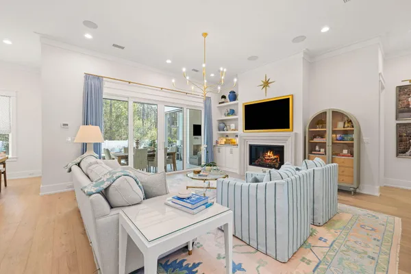 a bed room with furniture and a flat screen tv