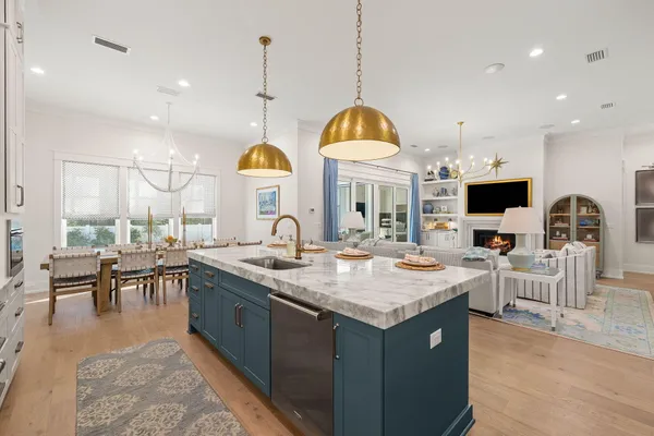 a kitchen with a sink and a stove top oven