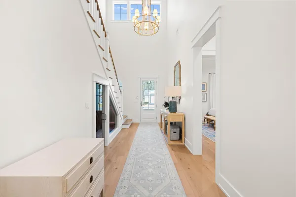 a kitchen with kitchen island granite countertop a sink a stove and a refrigerator