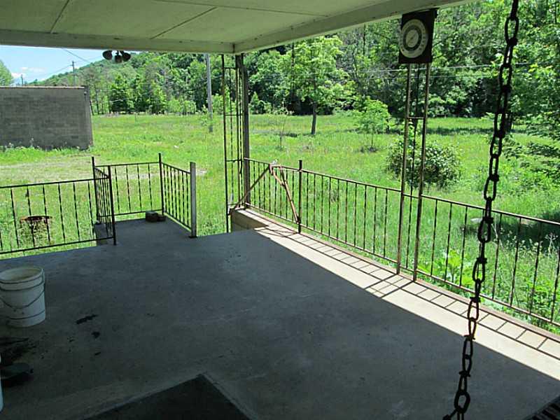 1112 Upper Mateer Road Vandergrift, PA 15690 - Photo 4 of 21 Patio/Deck. Another view of the patio and the land, 5.9 acres!