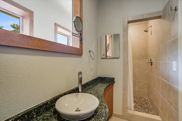 a bathroom with a sink and mirror