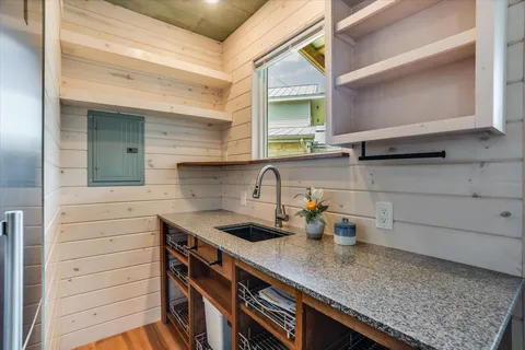 a kitchen with a sink and cabinets