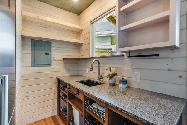 a kitchen with a sink and cabinets