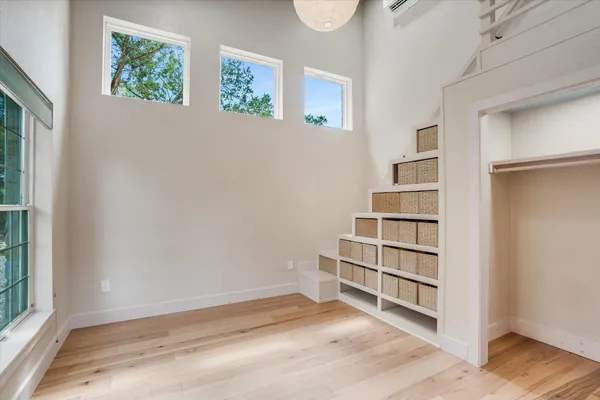 a view of room with walk in closet and window