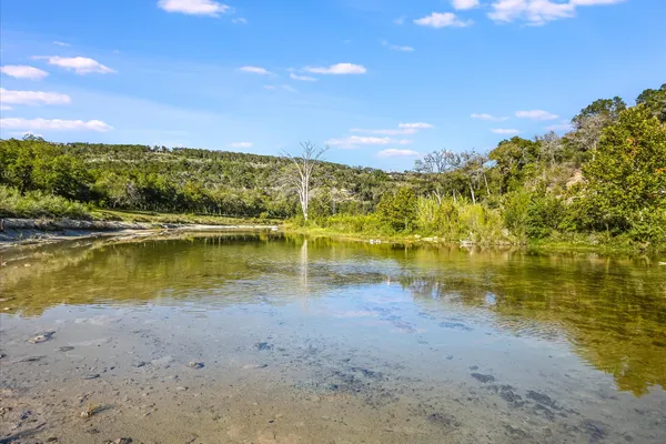 a view of an ocean and a mountain