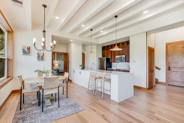 a view of a dining room with furniture window and wooden floor