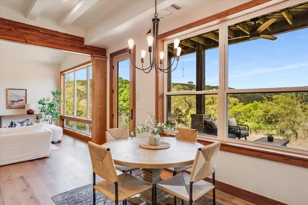 a view of a dining room with furniture window and outside view