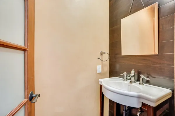 a bathroom with a sink and a mirror