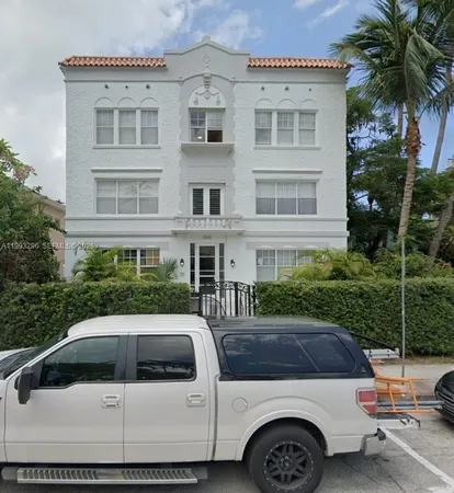 a view of a car parked in front of a house