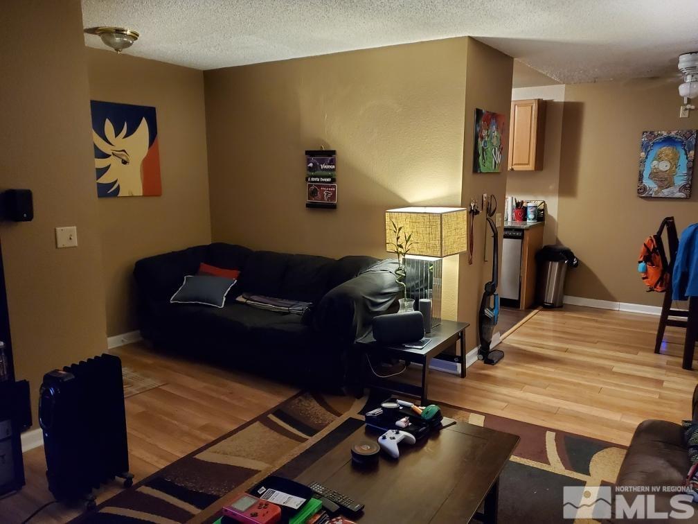 2095 Highview Court, Unit 7 Reno, NV 89512 - Photo 11 of 24 a living room with furniture and wooden floor