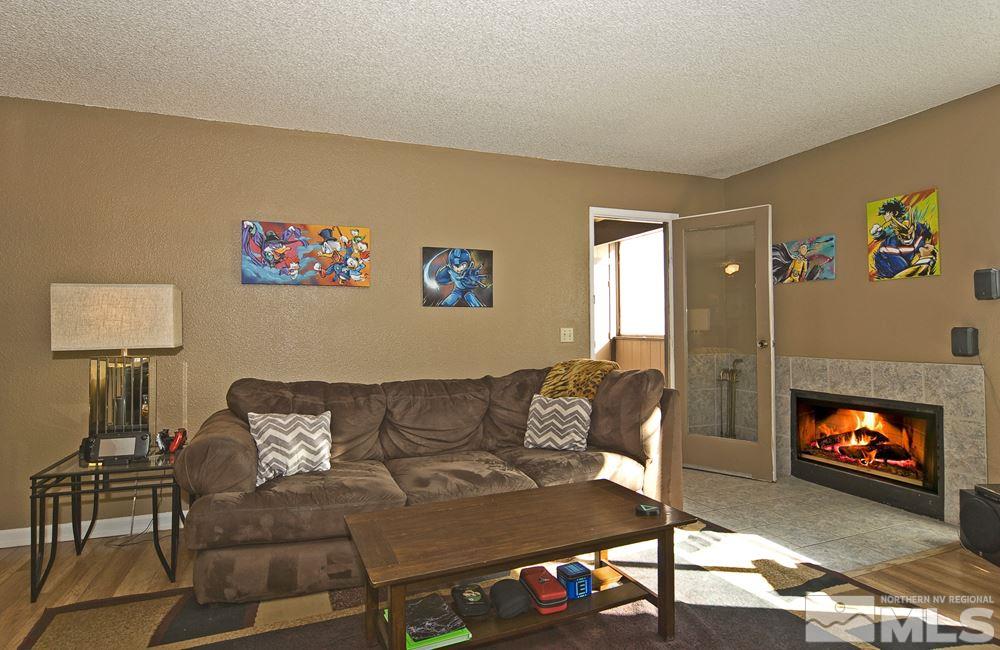 2095 Highview Court, Unit 7 Reno, NV 89512 - Photo 12 of 24 a living room with furniture and a fireplace
