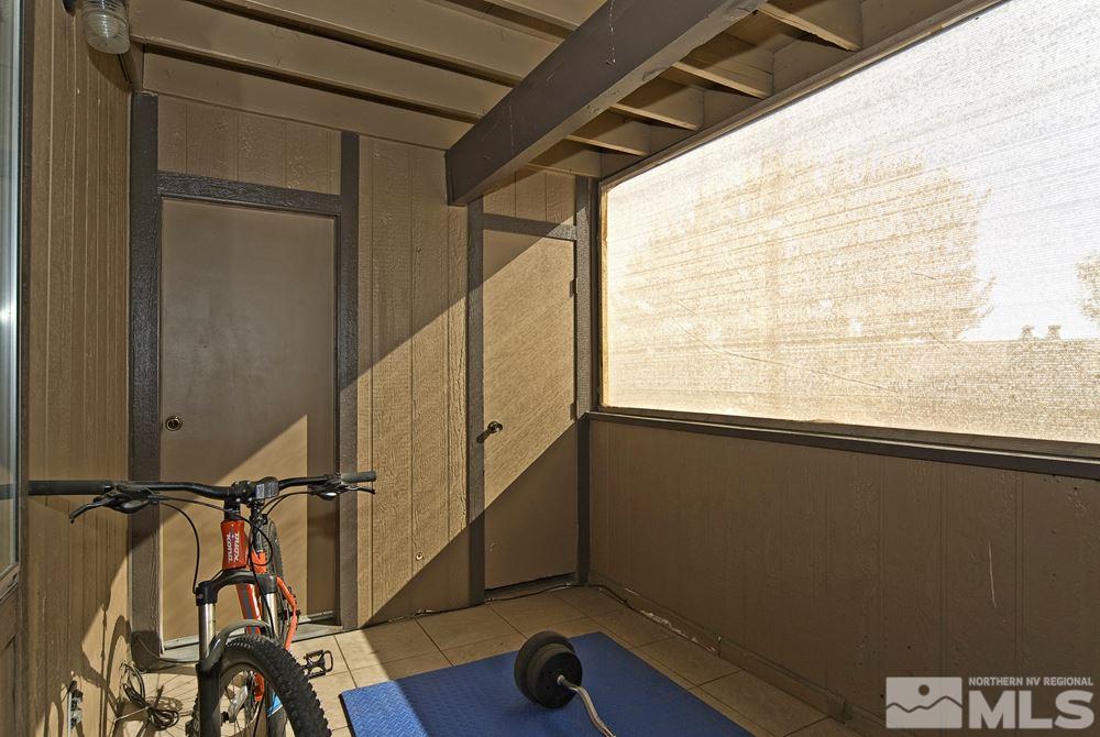2095 Highview Court, Unit 7 Reno, NV 89512 - Photo 14 of 24 a view of a room with wooden floor and windows