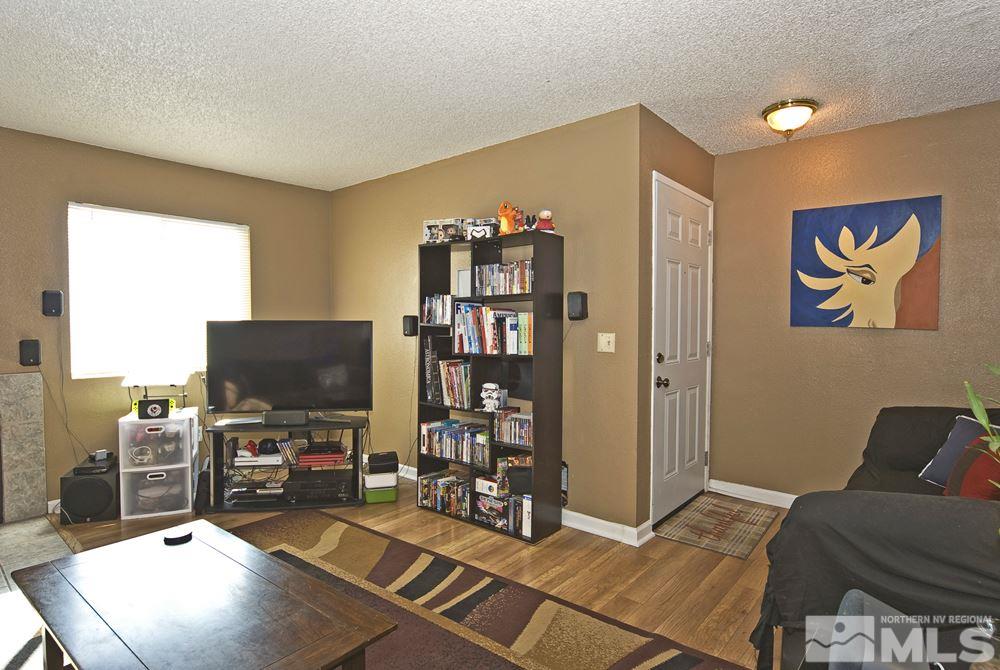2095 Highview Court, Unit 7 Reno, NV 89512 - Photo 9 of 24 a room with furniture and a flat screen tv